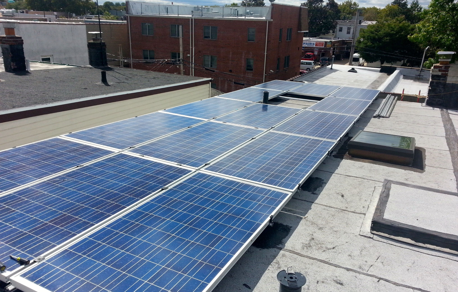 American Solar Partners - Flat roof solar panel installation