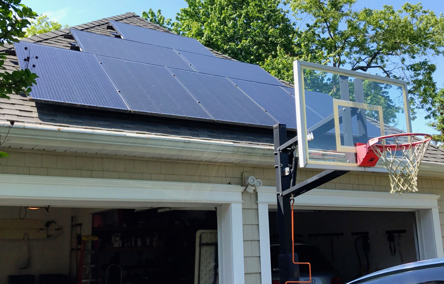 American Solar Partners - Slanted solar panel installation on a slanted residential garage roof