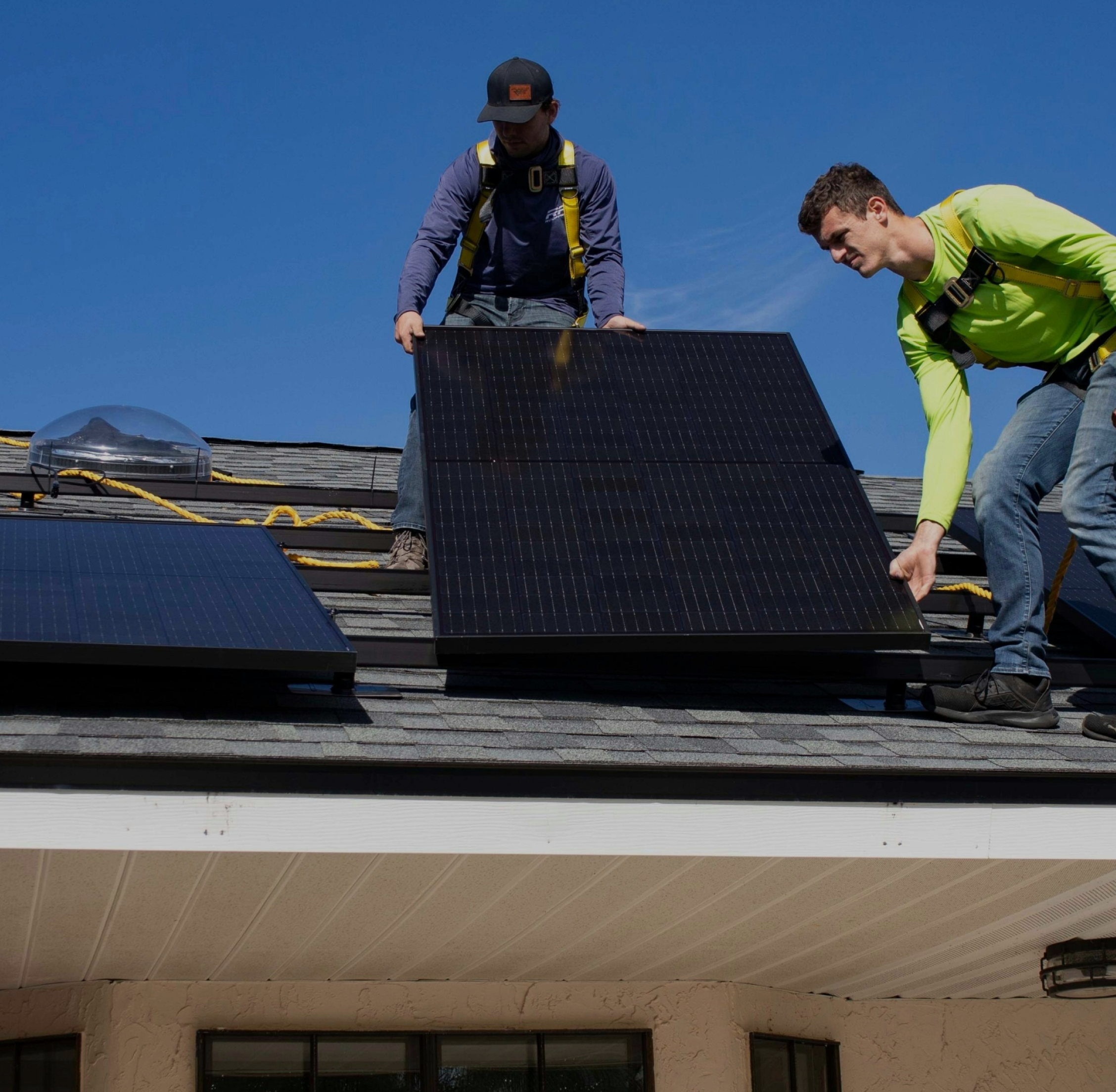 American Solar Partners - Two men installing solar on a roof
