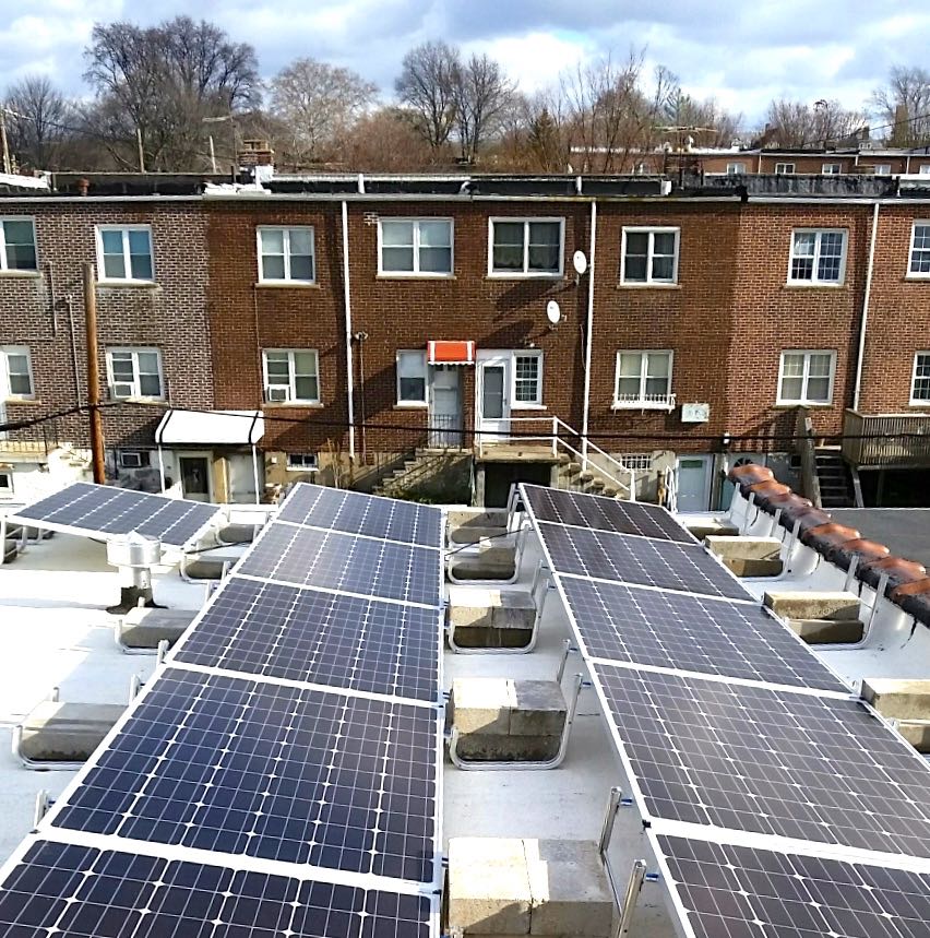 American Solar Partners - Solar panel installation on an urban roof